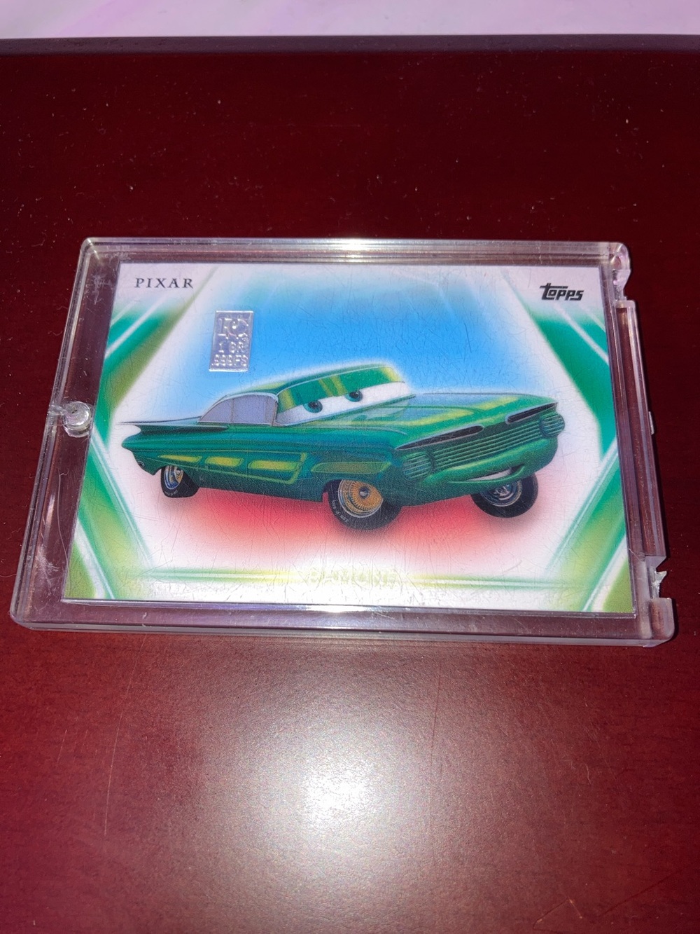 Topps Pixar Green Retro Car Trading Card with a 1 grain of .999 fine silver